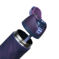 Owala FreeSip 24oz in Arctic Storm, exploded view showing the deep purple body, navy lid with periwinkle carry loop, deep purple flip cap with periwinkle FreeSip spout, and lavender silicone straw